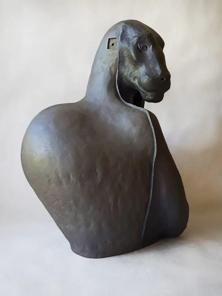 Stoneware sculpture resembling a big black antropomorphic panther