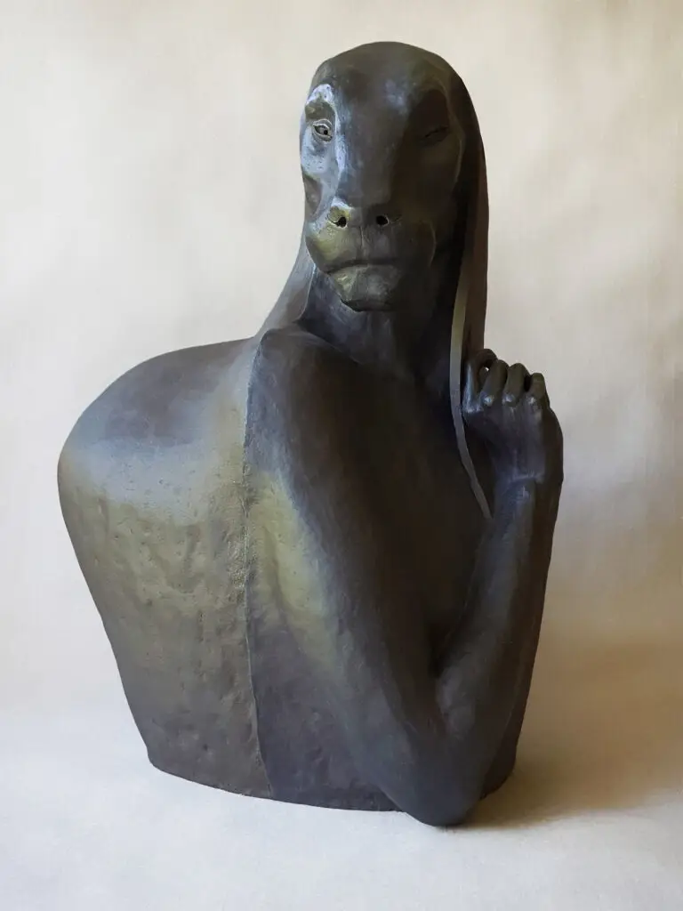 Stoneware sculpture resembling a big black antropomorphic panther